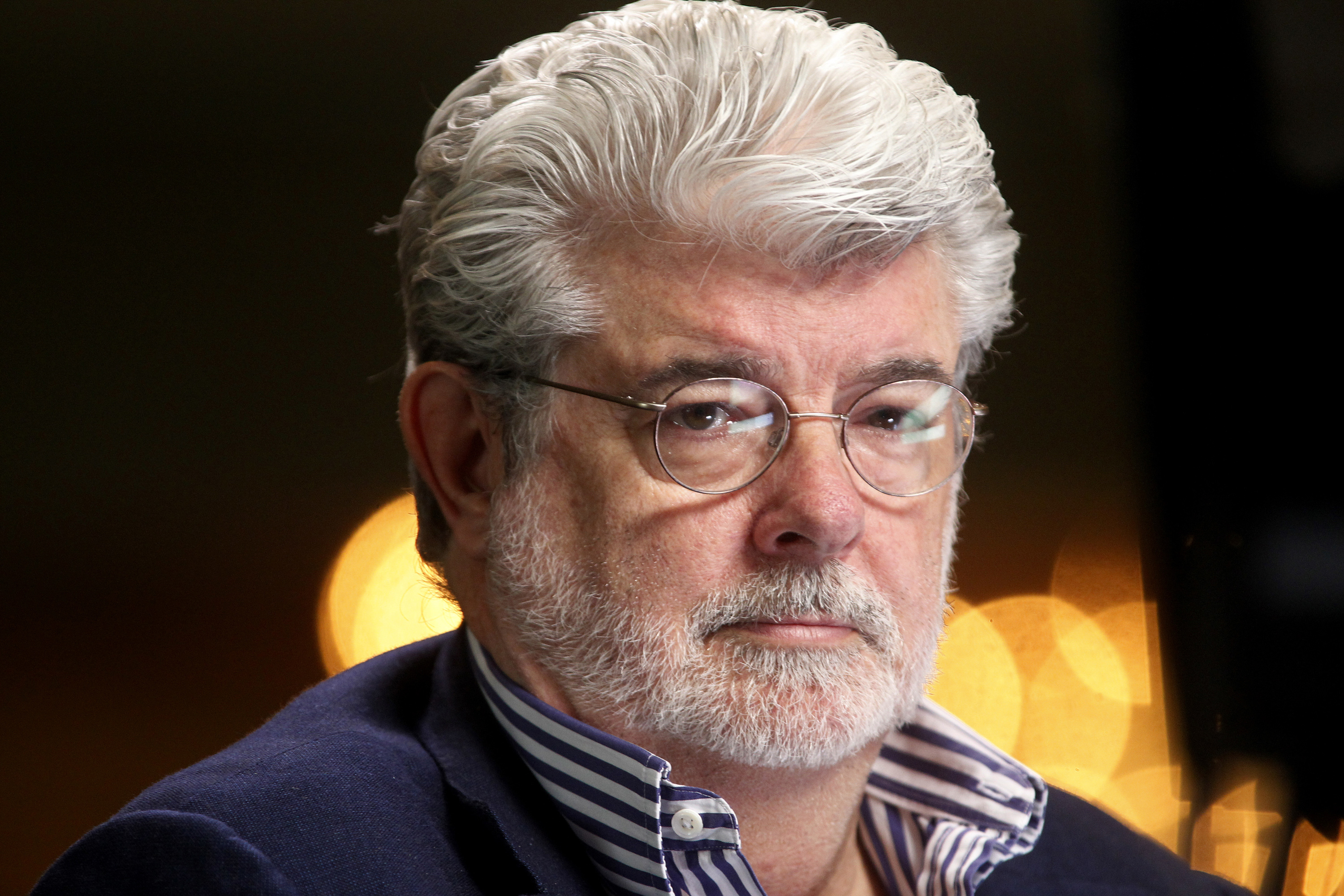Filmmaker and Chairman of the Board of Lucasfilm Ltd. George Lucas waits to do a television interview in Beverly Hills